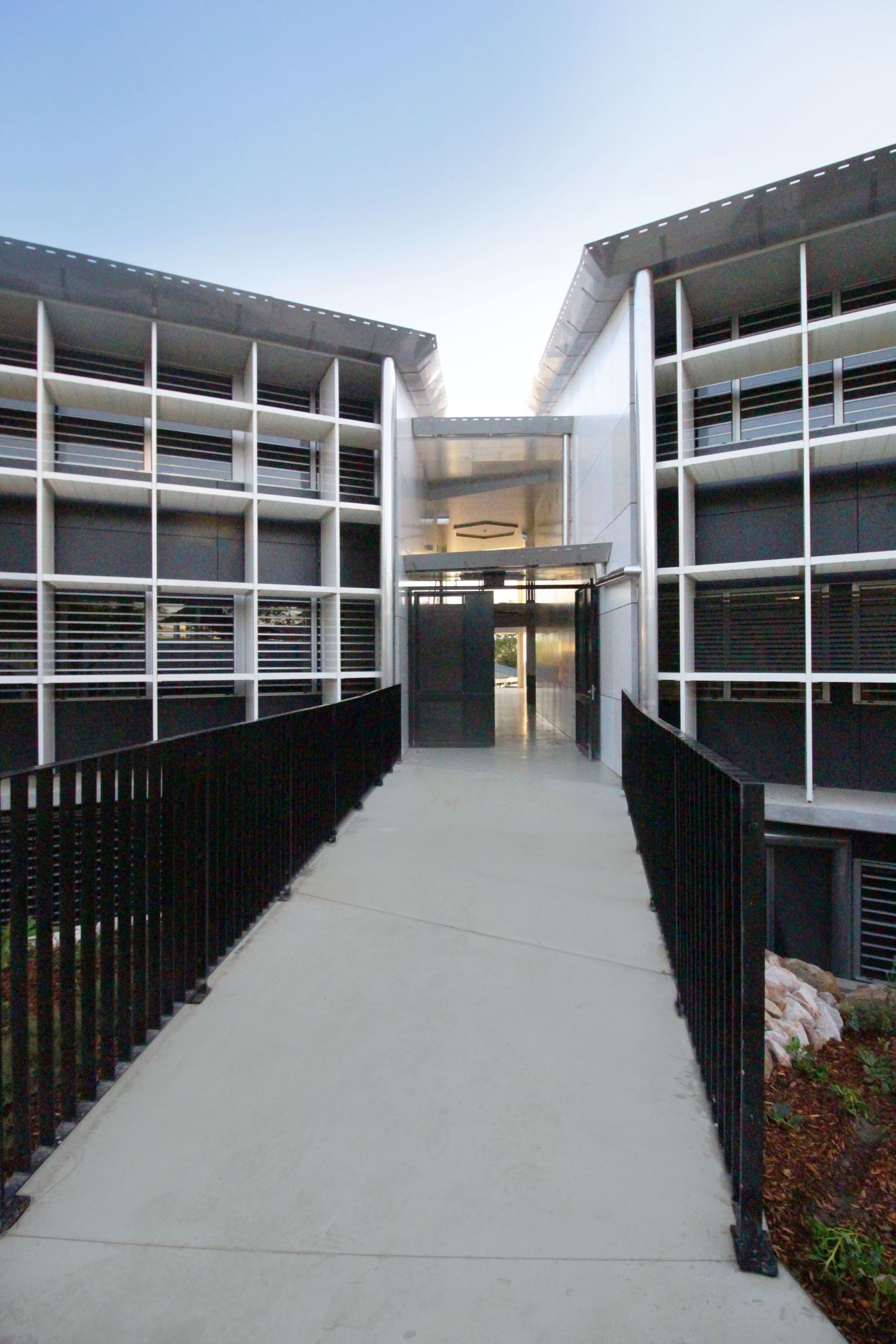 There is a ramp leading to the entrance of a building.