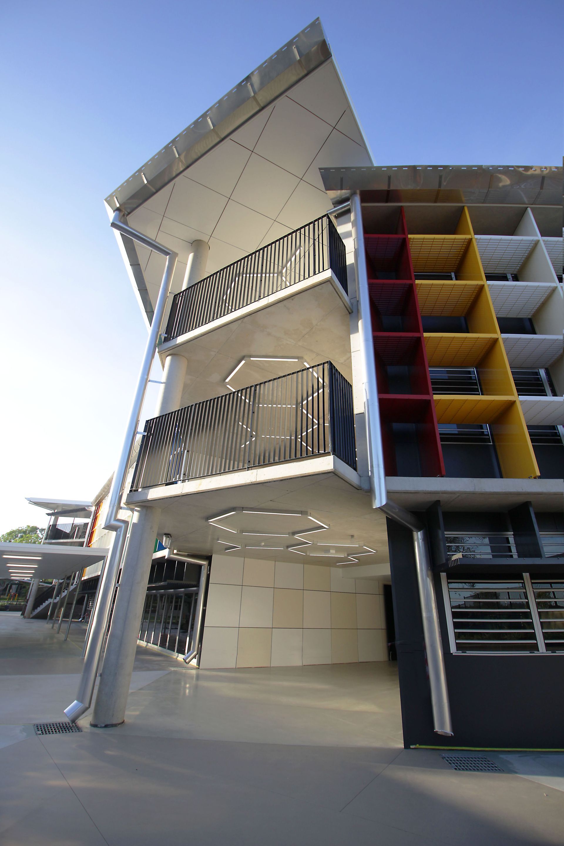 A large building with stairs leading up to the second floor
