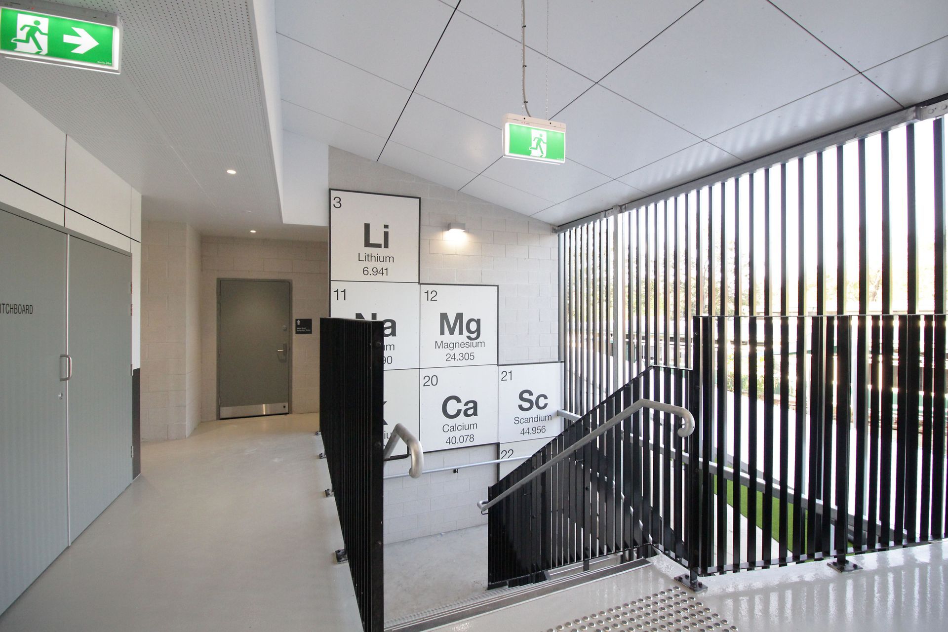 A staircase with a sign that says mg on it