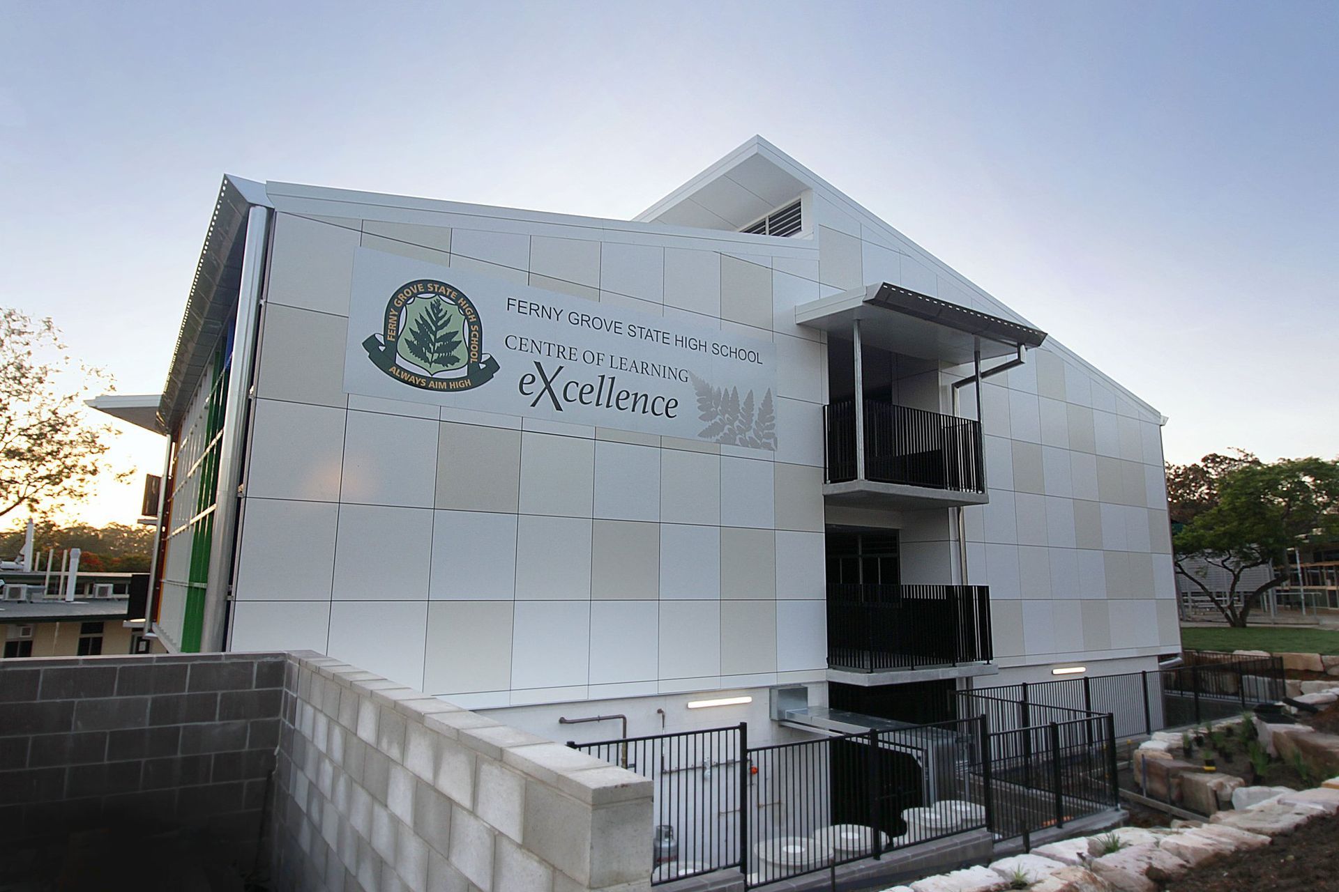 A white building with a sign on the side that says extreme