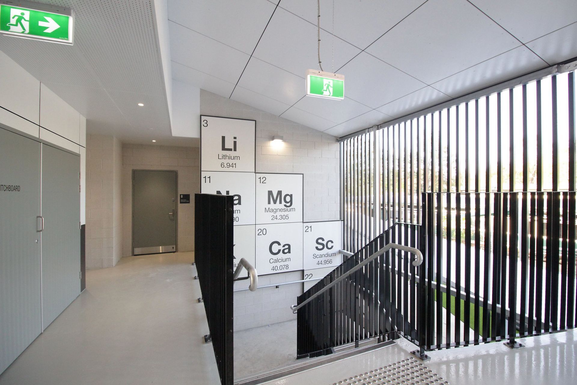 A staircase with a sign that says mg on it