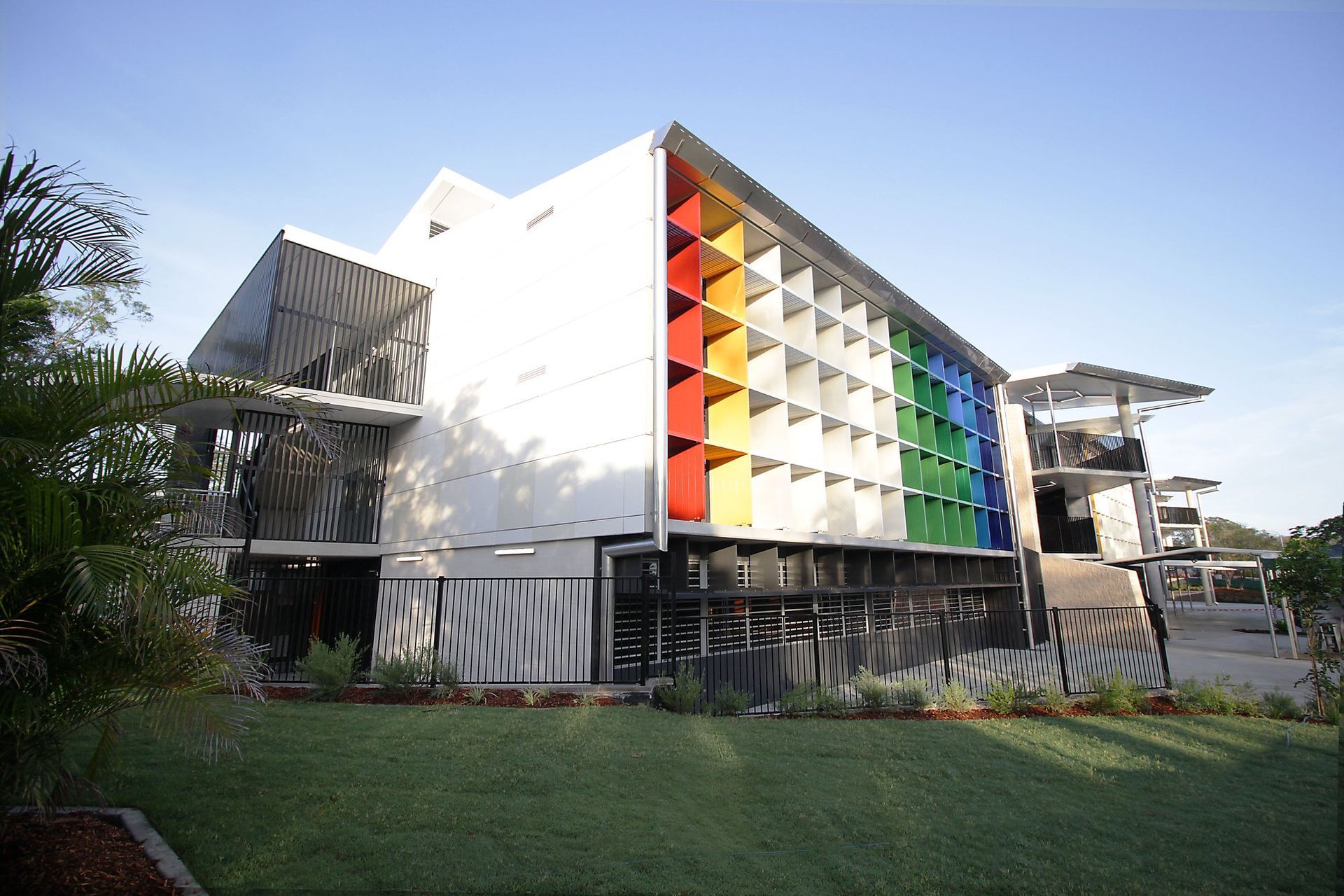 A large building with a rainbow of colors on the side