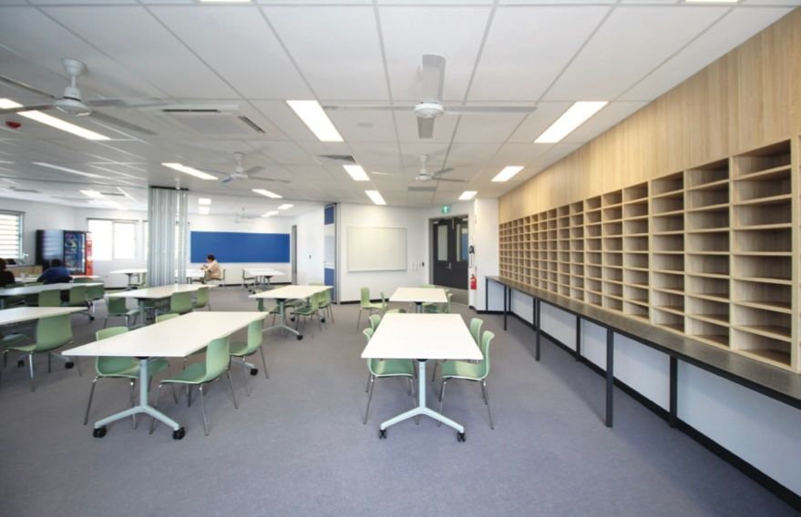 A large room with tables and chairs in it