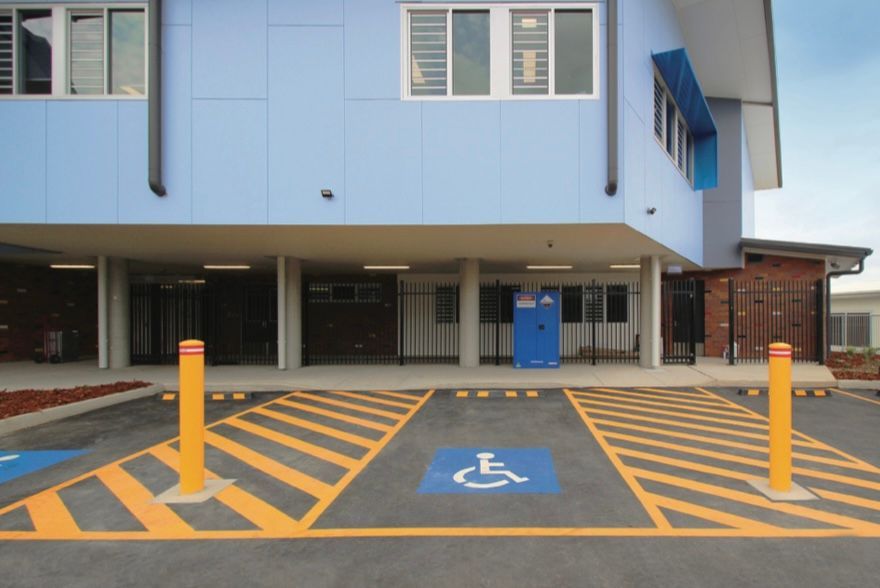 A handicapped parking spot in front of a building