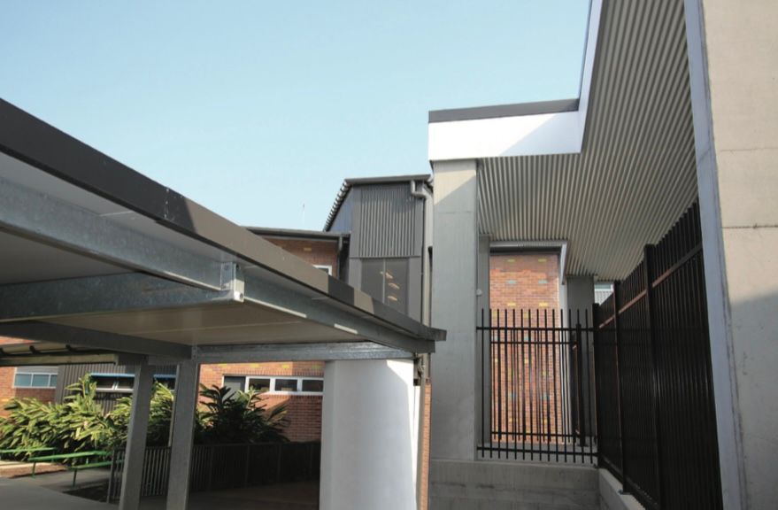 A building with a fence in front of it