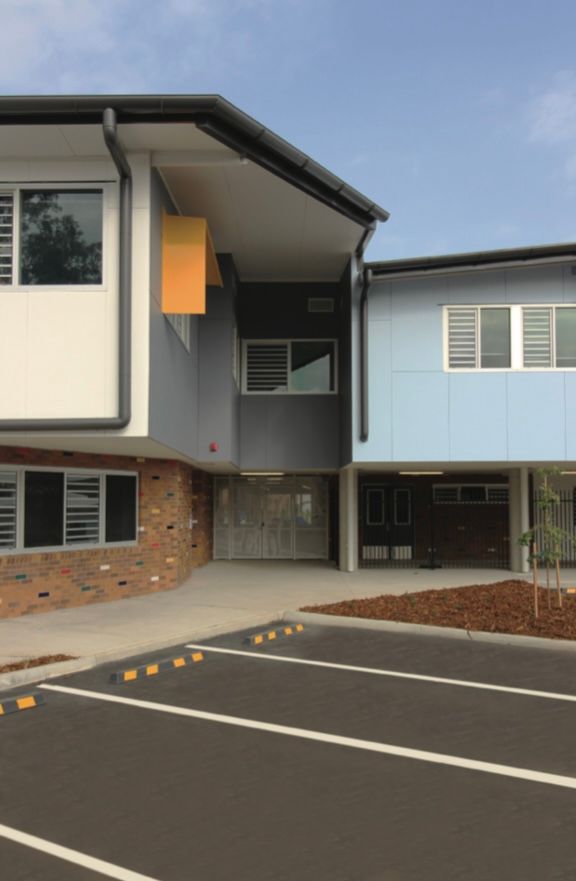 A building with a parking lot in front of it