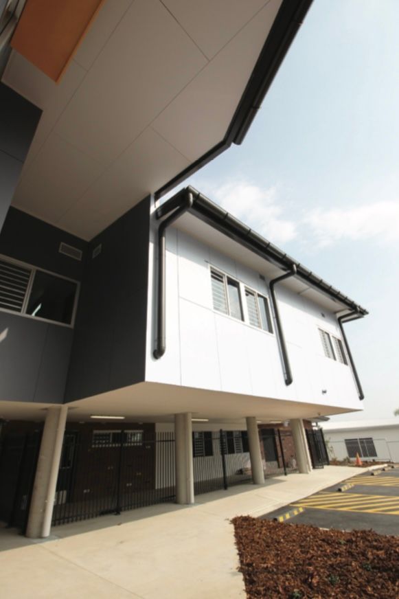 A large building with a lot of windows and gutters