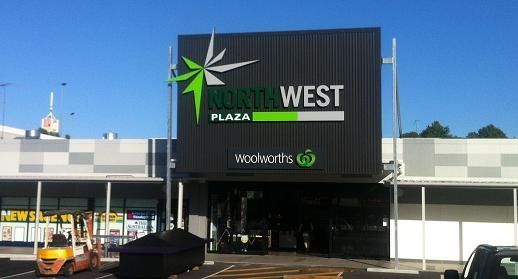 A store front with a sign that says ' north west plaza ' on it