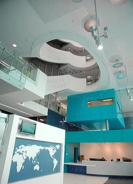 A large building with a map of the world on the wall