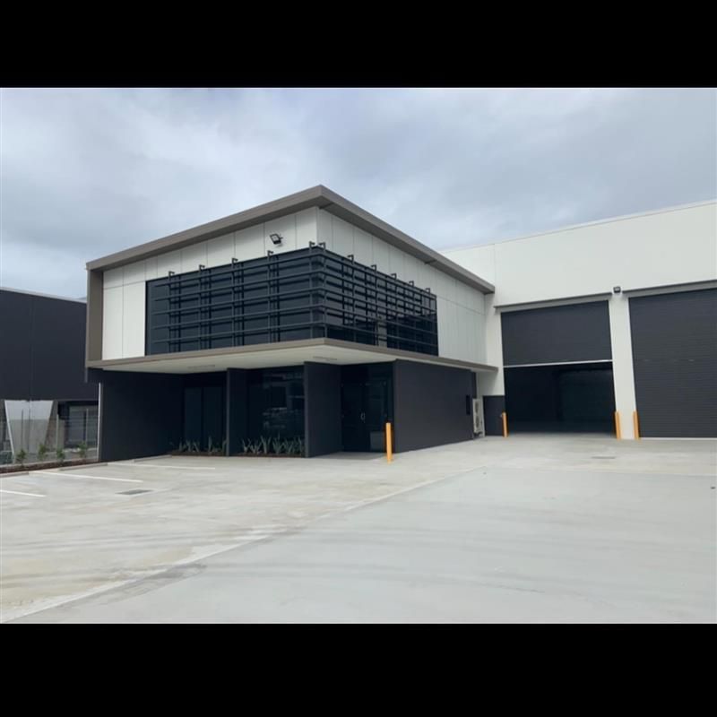 A large building with a lot of windows and a lot of doors.