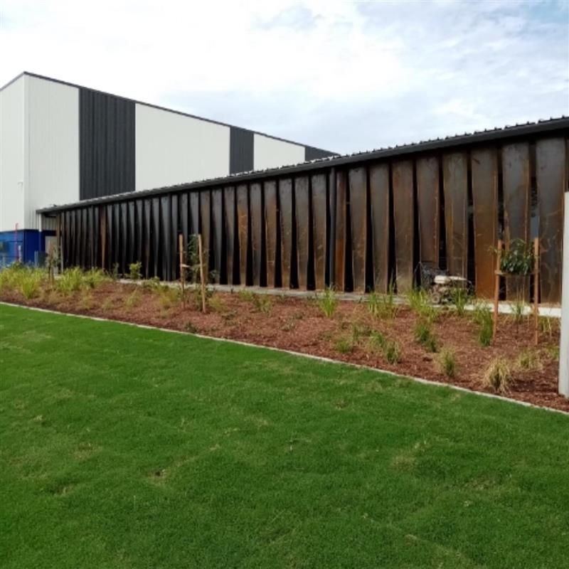 A large building with a fence in front of it