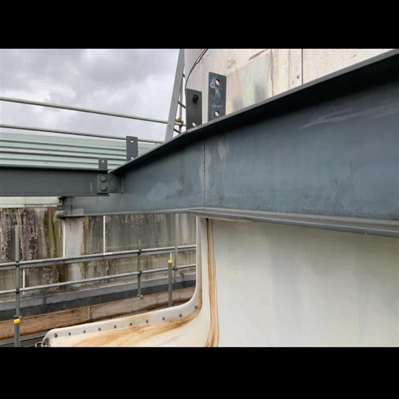 A close up of a metal structure on top of a building.