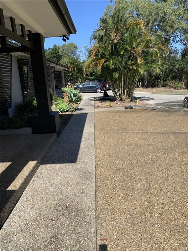 A house with a car parked in front of it