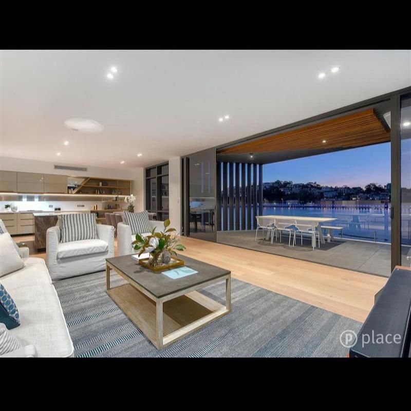A living room with a couch and chairs and a coffee table