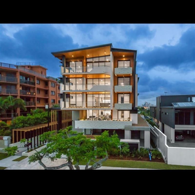 A large building with a lot of windows and balconies