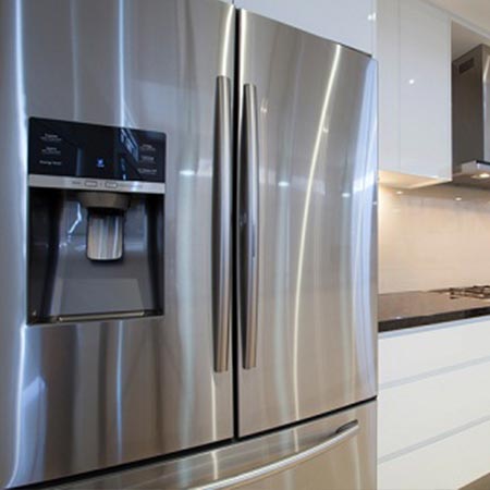 Stainless steel refrigerator in the kitchen