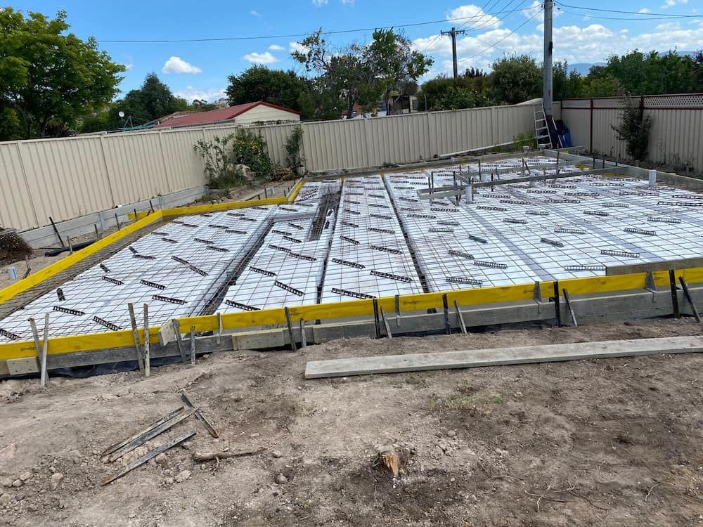 A Concrete Foundation is Being Built in a Backyard — Ozi Construction Pty Ltd in Sydney, NSW