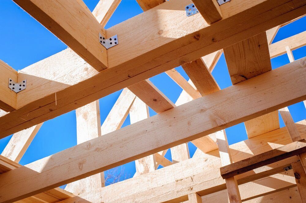 Looking Up at the Ceiling of a Wooden Structure Under Construction — Ozi Construction Pty Ltd in Griffith, ACT