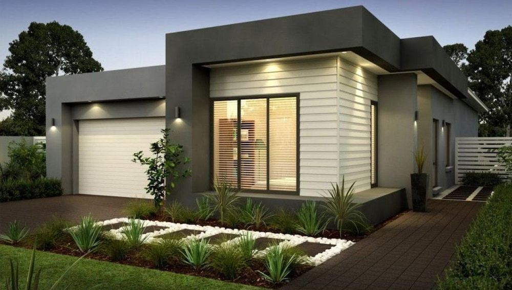 A Modern House With a White Garage Door — Ozi Construction Pty Ltd in Sydney, NSW