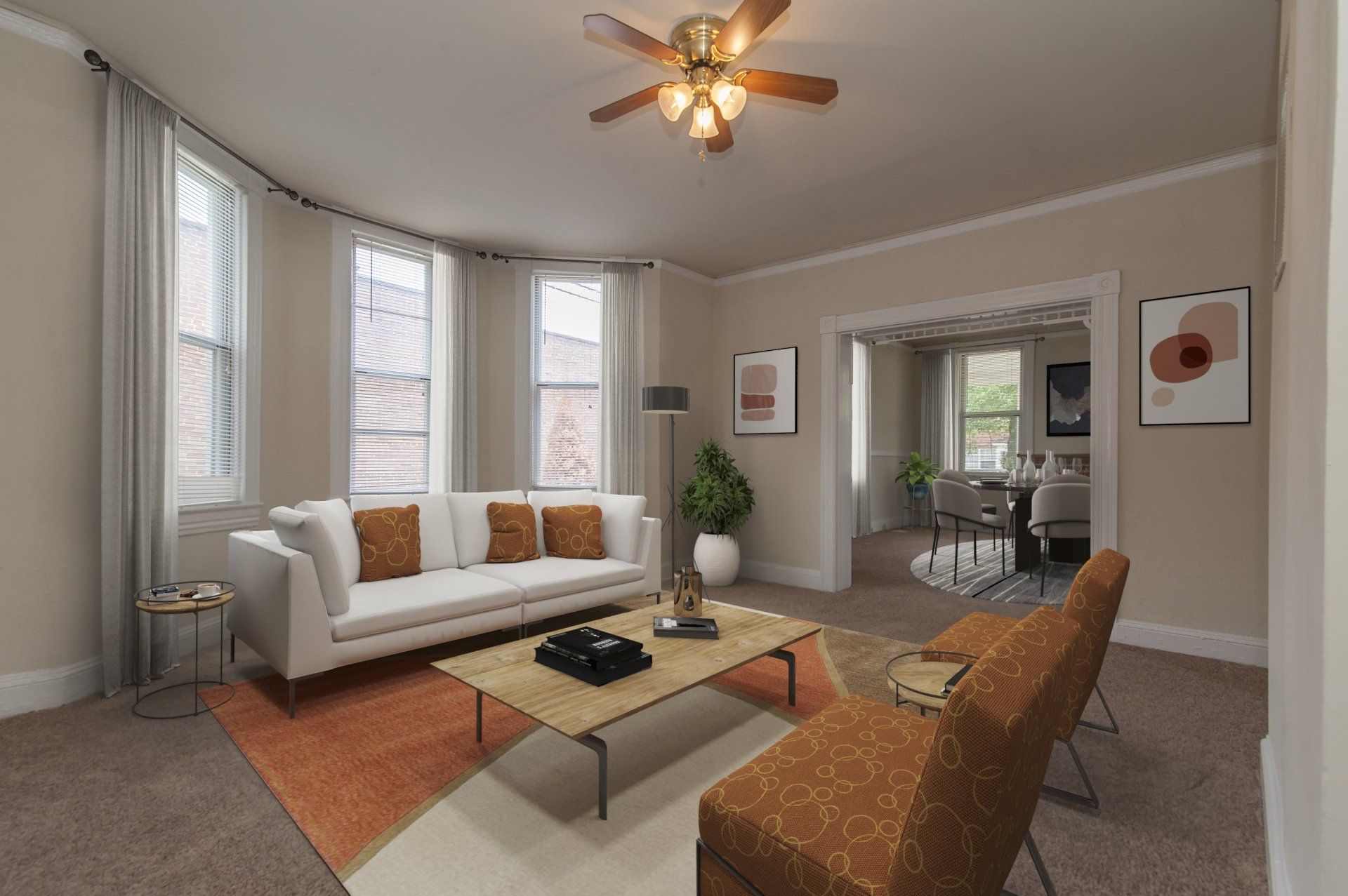 Living room with large windows and ceiling fan