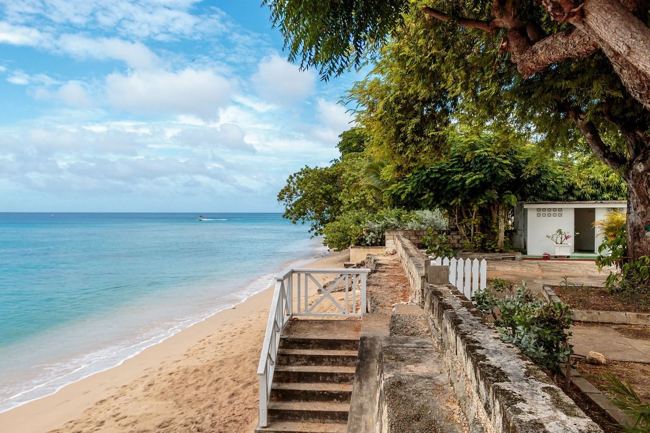 There are stairs leading up to the beach and the ocean.