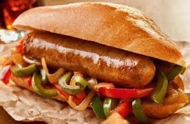 Sausage sandwich on a roll with peppers and onions.