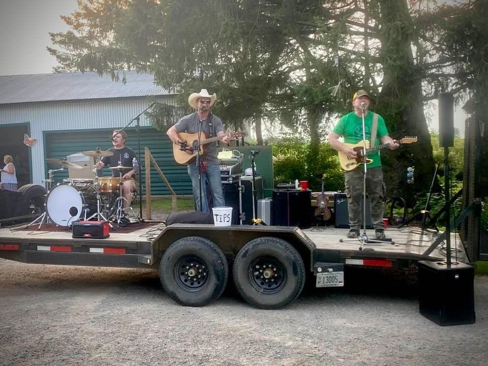 A band is playing music on a trailer.