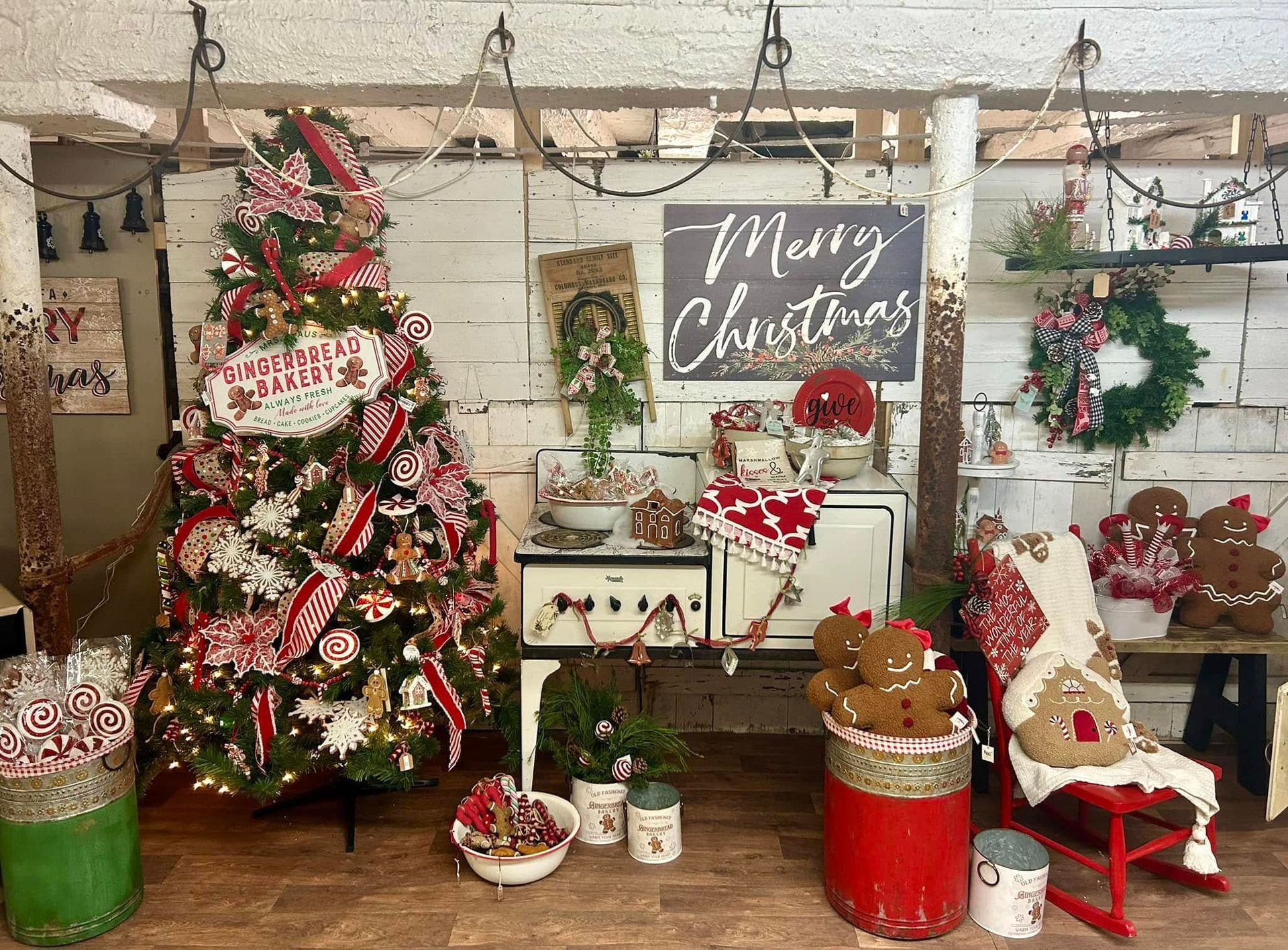 There is a christmas tree in the middle of the room.