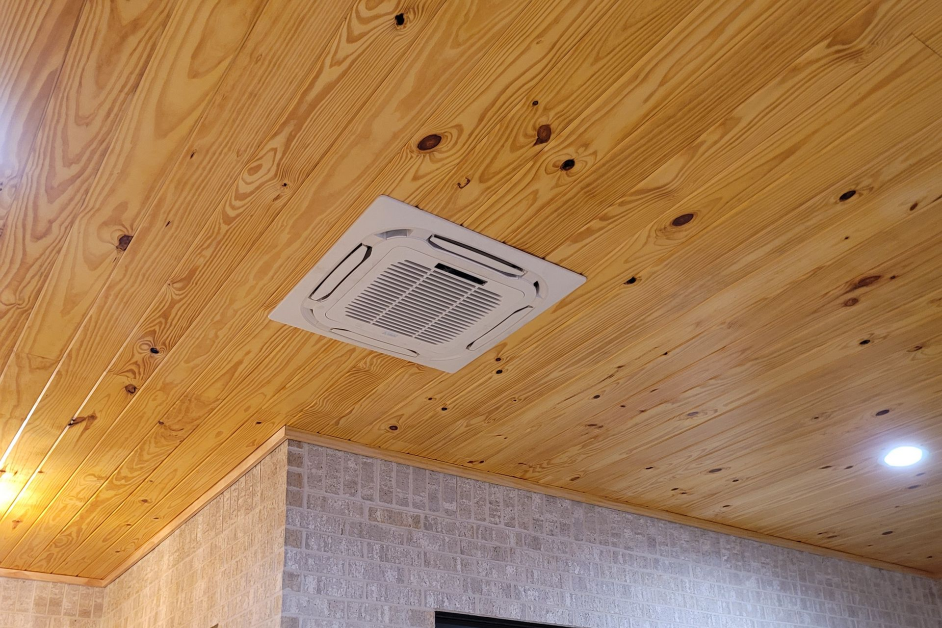 Ceiling Cassette mini-split AC unit installed in a coastal home Orange Beach