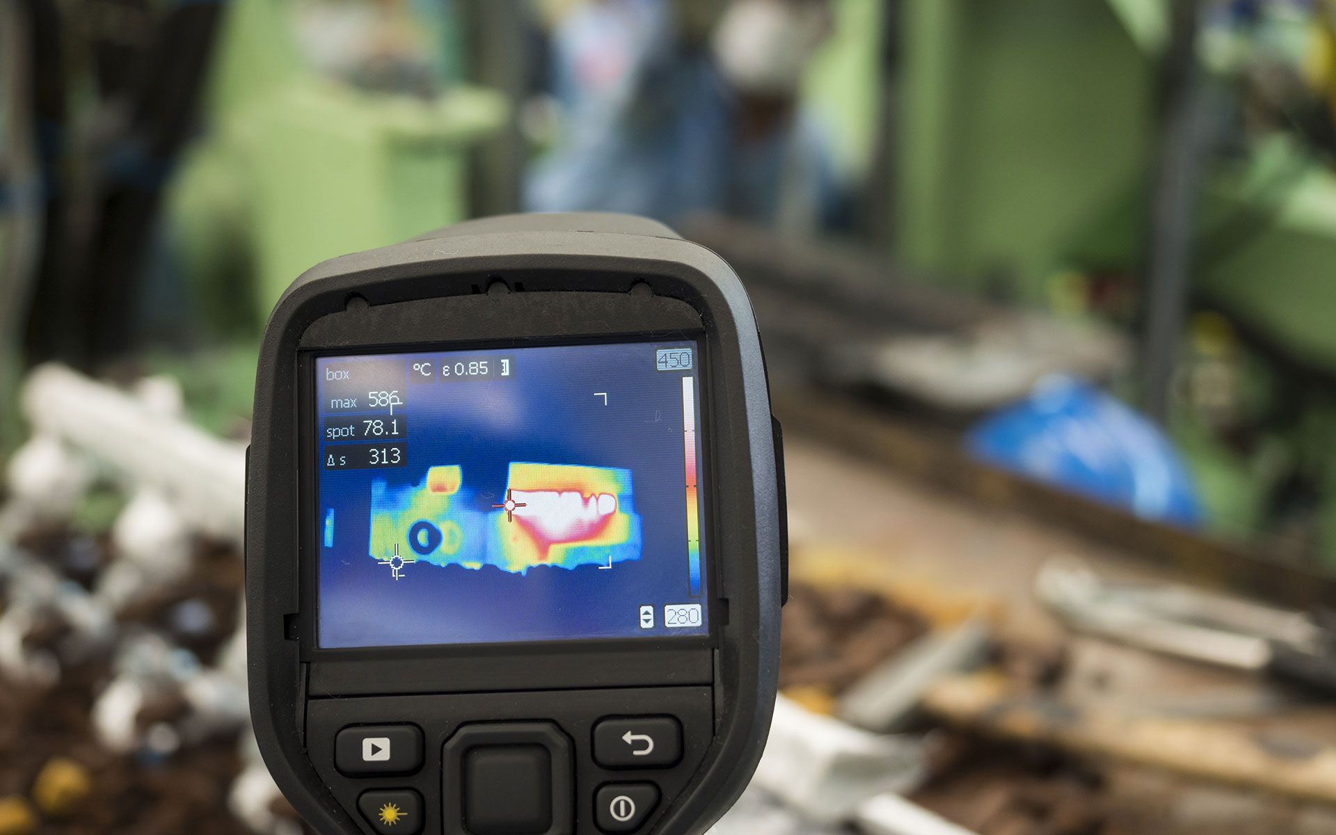 Thermal camera displaying a heat map, possibly inspecting industrial equipment.