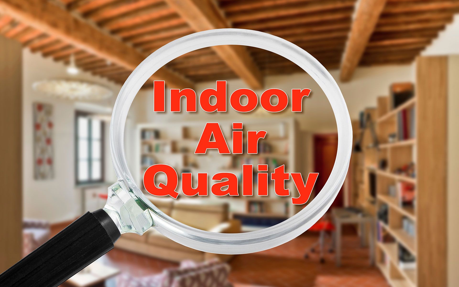 Magnifying glass over a room with text 