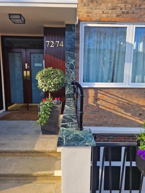 A wonderful marble column and handrail installation completed in London by Master Tiling