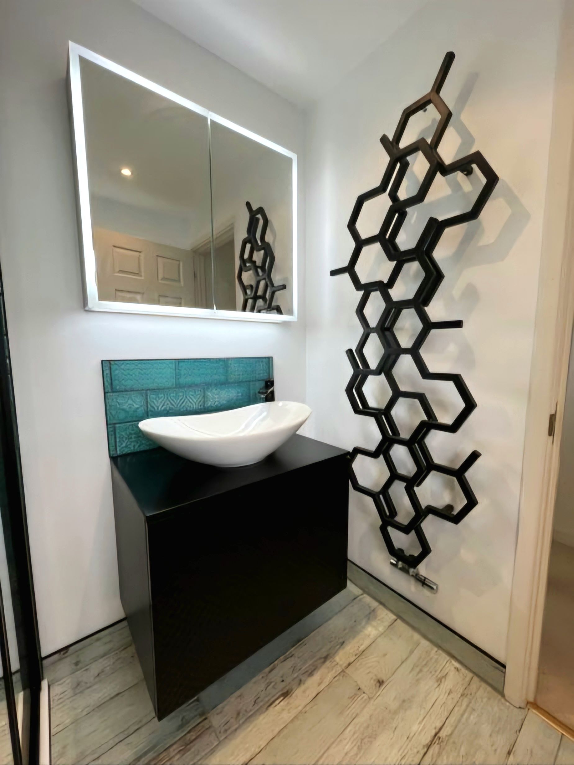 Lovely modern bathroom freshly refurbished in blue textured aquatic tiling in London