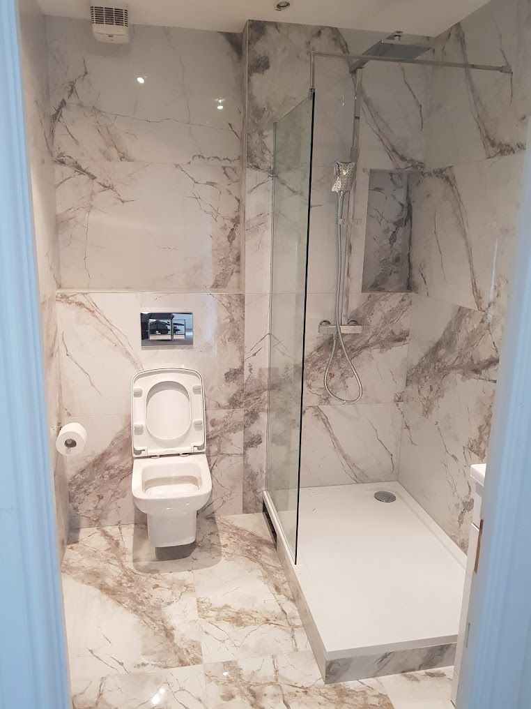 Lovely bathroom with Shower and toilet, tiled with Marble in Ruislip, London