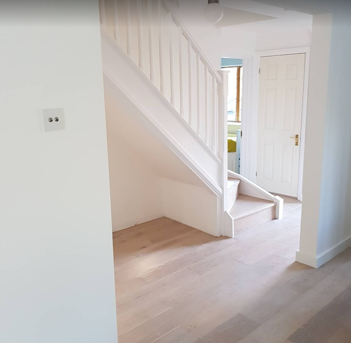 A lovely UK home installed with new wooden flooring and a staircase in Ruislip, London