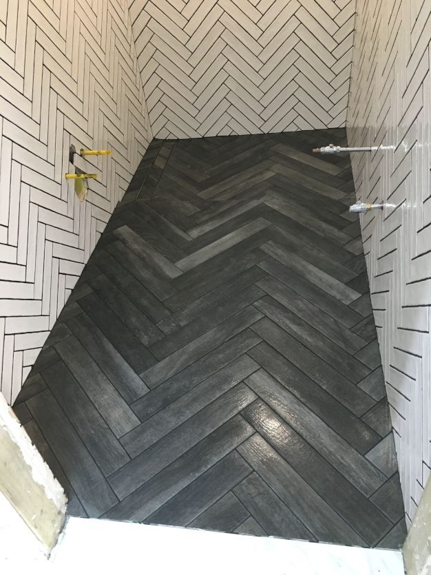 A lovely Herringbone-tiled bathroom in timeless Victorian style black and white.