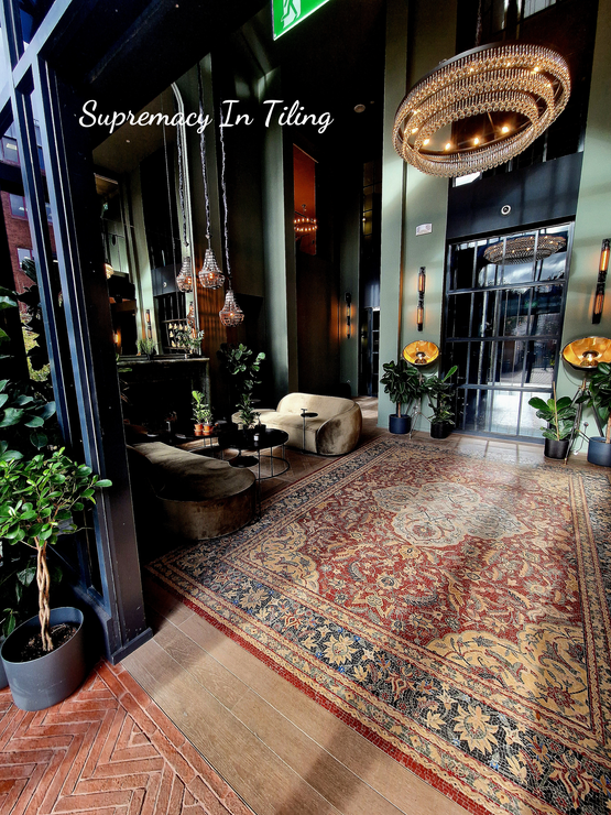 An amazing hotel lobby entrance, grand in style. On the floor is a beautiful tiled mosaic completed by Master Tiling in London.