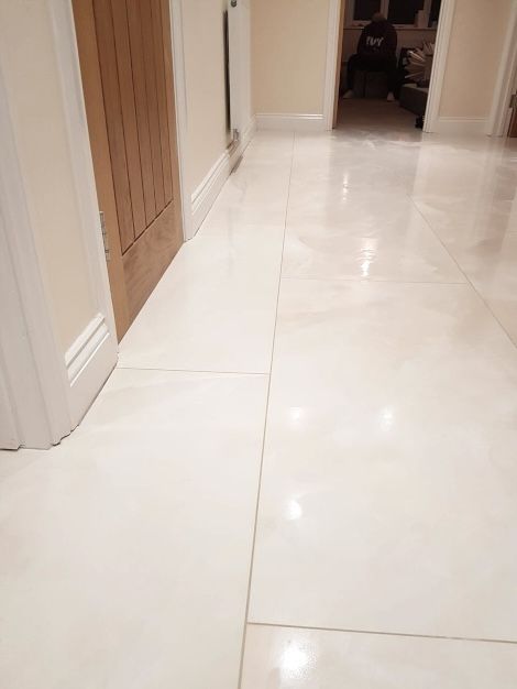 A lovely tiled white marble-effect floor completed by an expert installation done by Master Tiling in London