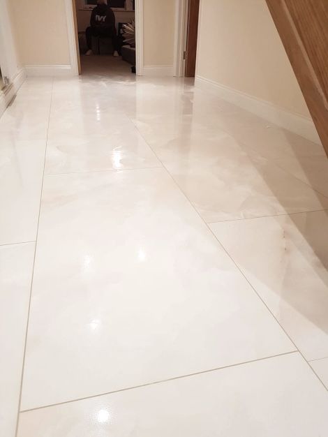 A lovely tiled white marble-effect floor completed by an expert installation done by Master Tiling in London