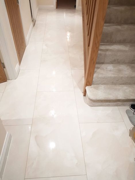 A lovely tiled white marble-effect floor completed by an expert installation done by Master Tiling in London