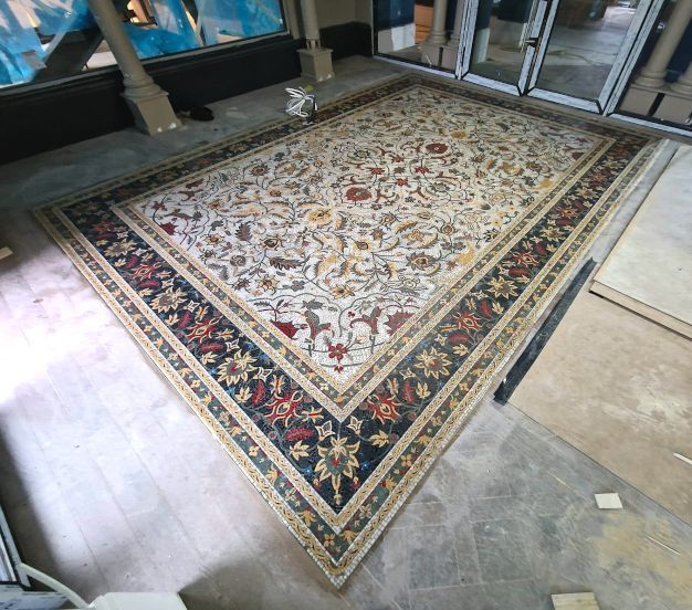 A grand entrance to the Brondesbury Apartments in London, featuring a beautifully tiled mosaic centrepiece expertly completed by Master Tiling