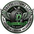 A logo for DBOYSCUSTOMS LLC in Yukon, OK featuring a winged tire, a spark plug, a piston, and a green letter D.