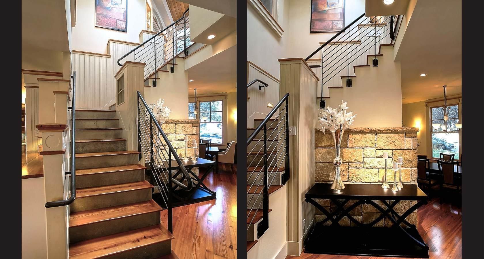 Two-story foyer with staircase, featuring ornate railing and light-colored walls, with dining area visible in background.