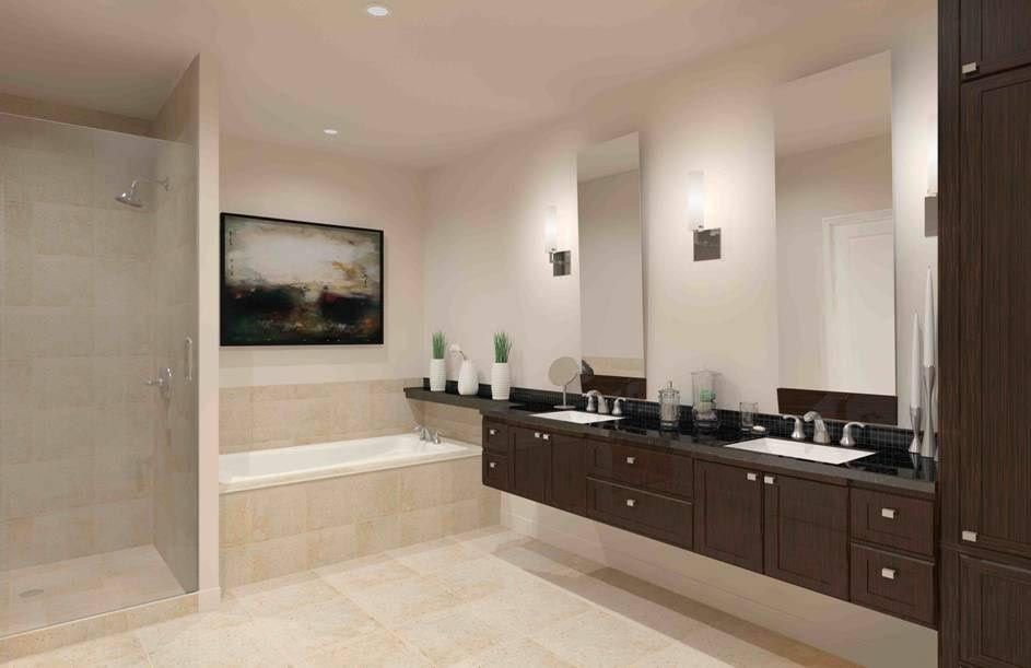 Modern bathroom with floating dark brown vanity, two sinks, large mirrors, and a glass shower.
