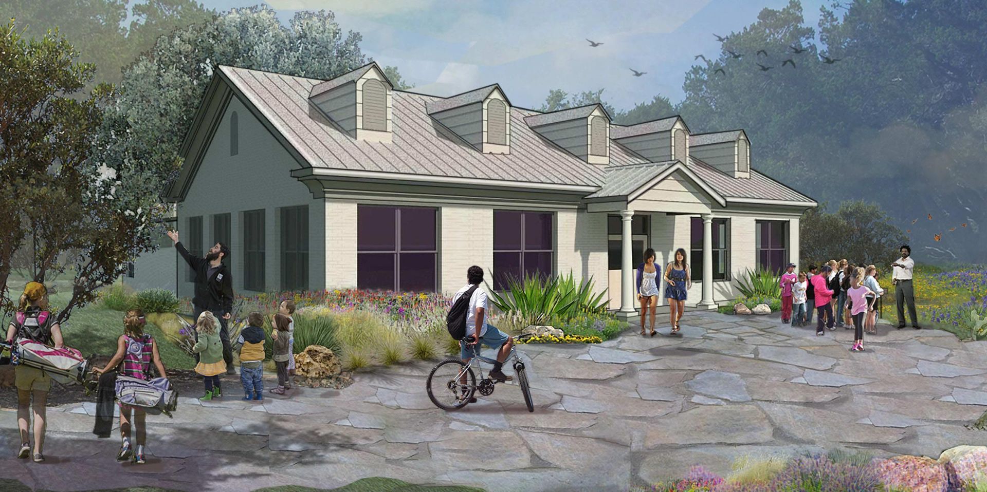 A group of people walking towards a building with dormer windows.