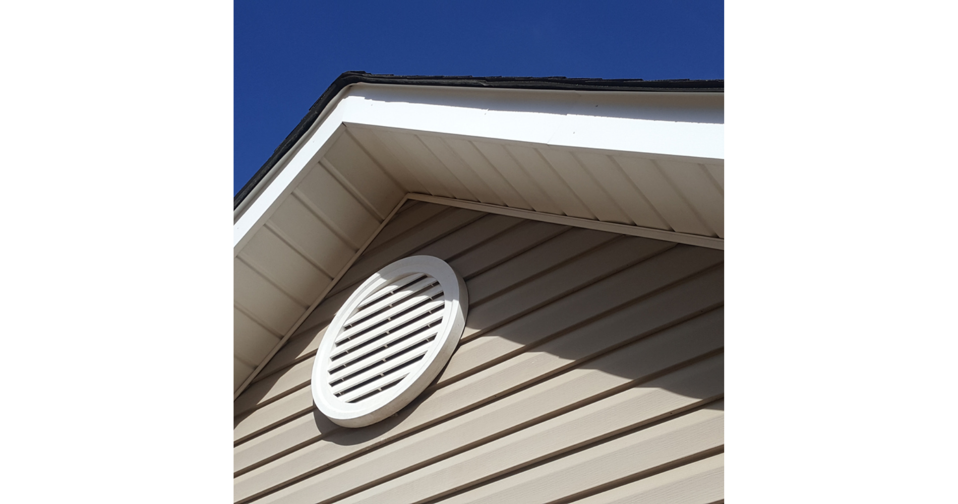 A house with a round vent on the side of it