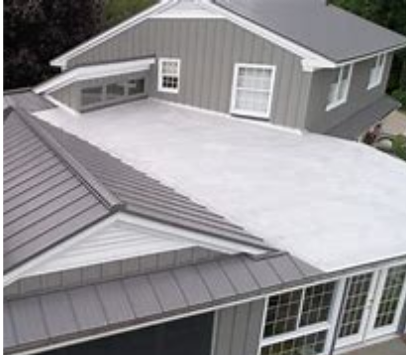 An aerial view of a house with a metal roof.