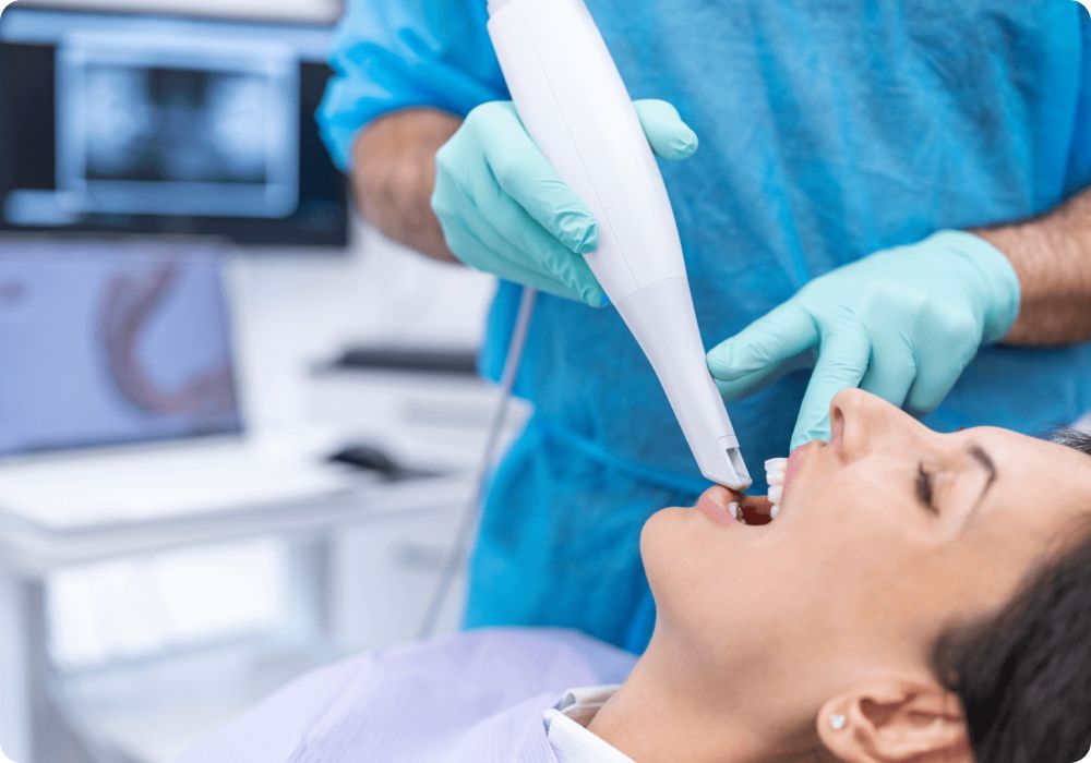 A woman is getting her teeth examined by a dentist.