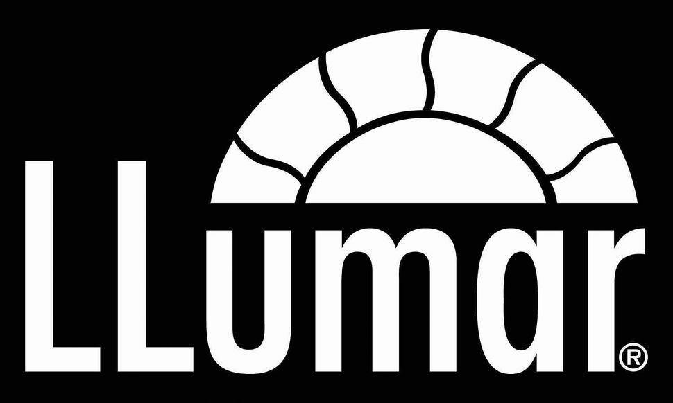 A white logo with a sun in the middle on a black background.