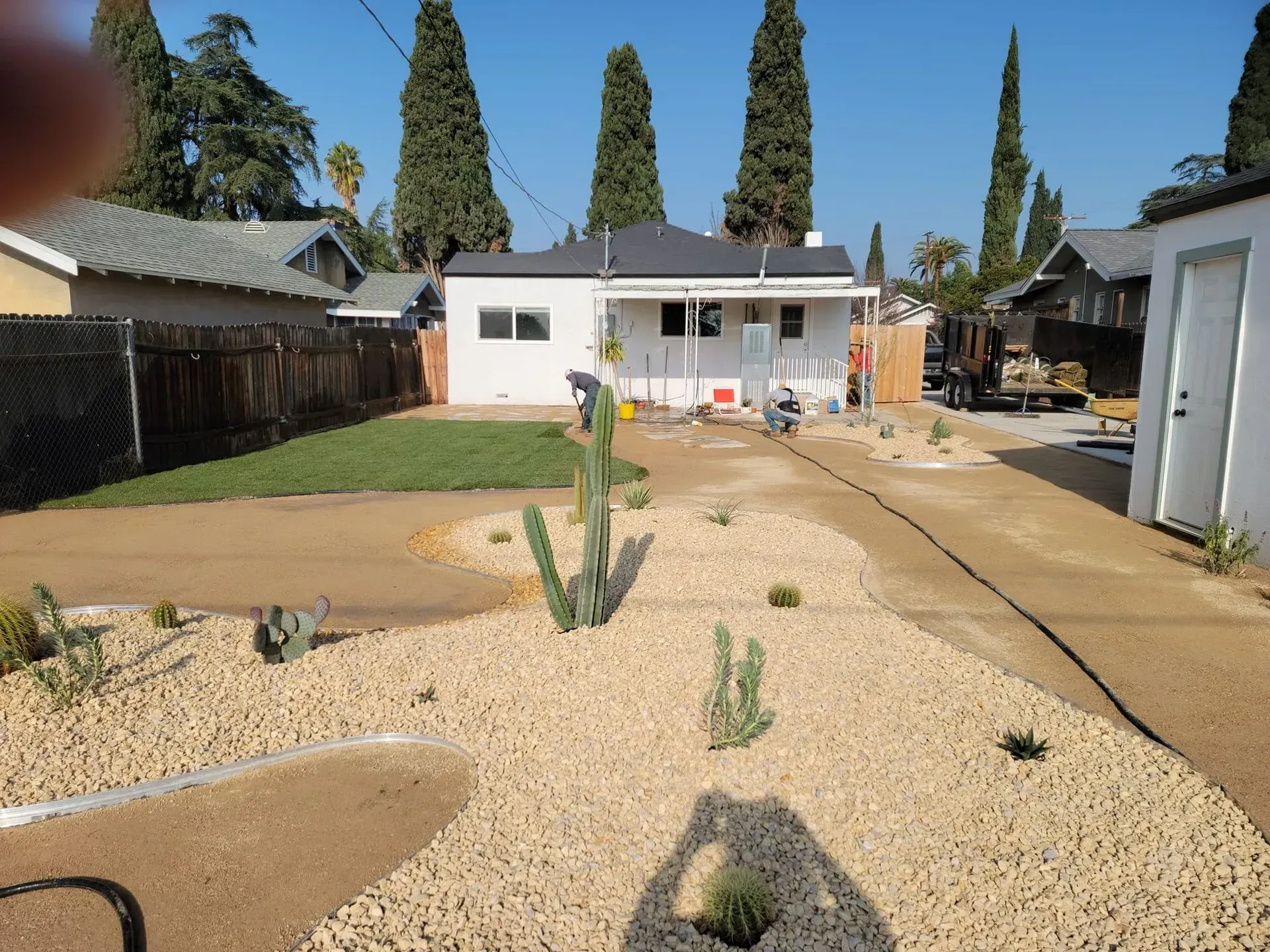 A house with a lot of rocks in front of it